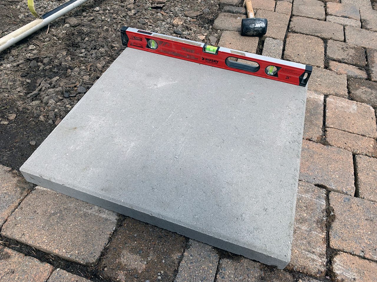 Leveling the first paver
